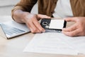 Cropped of businessman putting battery in