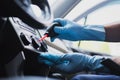 Cropped of car cleaner dusting dashboard