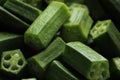 Cropped and chopped pieces of ladies fingers or Okra green vegetables display with selective focus.