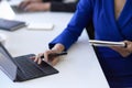 Cropped, close-up image, Businesswoman using portable tablet