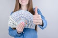 Cropped close-up photo portrait of beautiful pretty positive she her lady holding money in hand giving making finger up approve Royalty Free Stock Photo