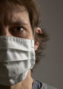 Cropped close up photo portrait of terrified frightened feeling bad human wearing facial mask,