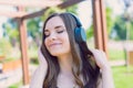 Cropped close-up photo of sweet optimistic cheerful calm excited pretty attractive gorgeous teenager lady hearing favorite melody