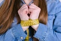 Cropped close up photo of unhappy sad upset lady showing demonstrating tied hands near chest in casual denim shirt  grey Royalty Free Stock Photo