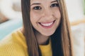 Cropped close up portrait of gorgeous peaceful young lady sit sofa beaming smile spend pastime weekend apartment inside Royalty Free Stock Photo