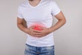 Cropped close up studio photo portrait of upset sad scared worried troubled gut having stomach ache disorder wear denim pants