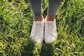 Cropped close-up view of her she nice attractive fashionable girl legs wearing casual cosy comfortable sporty sneakers Royalty Free Stock Photo