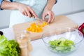 Cropped close-up view of nice hands housewife housemaid cooking dish salad meal snack cutting pepper stay home cafe