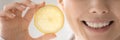 Cropped close up woman with healthy smile holding lemon slice Royalty Free Stock Photo