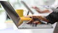 Businesswomen hands typing, using, working on laptop computer at office Royalty Free Stock Photo