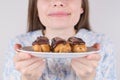 Cropped closeup photo of comic facial expression lovely girl wants to eat all of the plate isolated grey background
