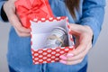 Cropped closeup photo of excited happy confident business businesswoman showing package with stack pile of money holding in hands