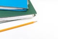 Cropped colorful folders with documents and bills and a yellow pencil on white table with copy space Royalty Free Stock Photo