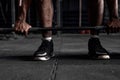 cropped Confident muscular afro american man training squats with barbells at gym. Royalty Free Stock Photo