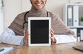 Cropped of female doctor showing digital tablet with blank screen Royalty Free Stock Photo