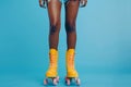 cropped female legs in rollerskates  on bright plain background in studio, female wearing roller blades on Royalty Free Stock Photo