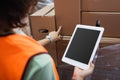 cropped female warehouse worker in safety