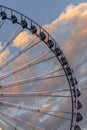 Cropped Ferris wheel at dusk with clouds in the back Royalty Free Stock Photo