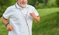 Cropped frontview of running old man. Royalty Free Stock Photo