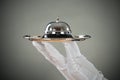 Cropped Hand Of Waiter Holding Service Bell In Tray Royalty Free Stock Photo