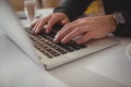 Cropped hands of businessman using laptop Royalty Free Stock Photo