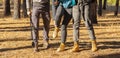 Cropped of hikers having trouble, lady hurt her feet