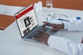 Cropped image of african american doctor reading news on a