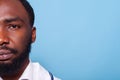 Cropped image of african american medic looking confident and relaxed in white lab coat with stethoscope Royalty Free Stock Photo