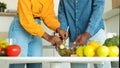 Cropped image of african american spouses cooking healthy vegetarian food in kitchen, panorama, closeup