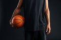 Cropped image of an african basketball player holding ball