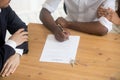 Cropped image african married couple signing lease contract