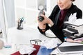 Cropped image of aggressive businesswoman holding electric drill