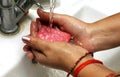 Cropped Image Of an asian Woman Washing Hands In Sink At Home. Selective focus Royalty Free Stock Photo