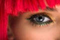 cropped image of attractive woman with red hair and makeup looking at camera