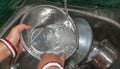 Cropped image of attractive young Indian woman is washing dishes close up. daily task concepts. Selective focus Royalty Free Stock Photo