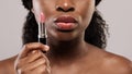 Cropped Image Of Beautiful Nude Black Woman Holding Pink Lipstick In Hand Royalty Free Stock Photo