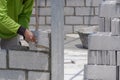 bricklayer making interior concrete block wall inside of house construction site Royalty Free Stock Photo