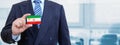 Cropped image of businessman holding plastic credit card with printed flag of Iran. Background blurred