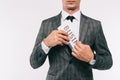 cropped image of businessman putting newspaper in jacket pocket