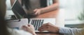 Cropped image of businessman`s hands is using a computer laptop. Royalty Free Stock Photo