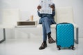 Cropped image of businessman sitting in waiting room Royalty Free Stock Photo