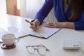 Cropped image, Businesswoman signing a documents