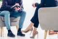 Cropped image of businesswoman in suit giving interview to journalist Royalty Free Stock Photo