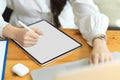 Cropped image of businesswoman using digital tablet with stylus pen on worktable Royalty Free Stock Photo