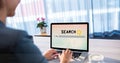 Cropped Image of businesswoman working on laptop with text while having coffee at office Royalty Free Stock Photo