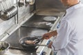 cropped image of chef frying meat Royalty Free Stock Photo