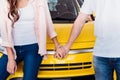 Cropped image of couple holding hands in front of new Royalty Free Stock Photo