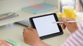 Cropped image of creative people hands` holding a cropped black computer tablet with white blank screen . Royalty Free Stock Photo