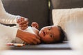 Cute black baby on sofa