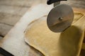 Cropped image of cutter cutting pastry dough